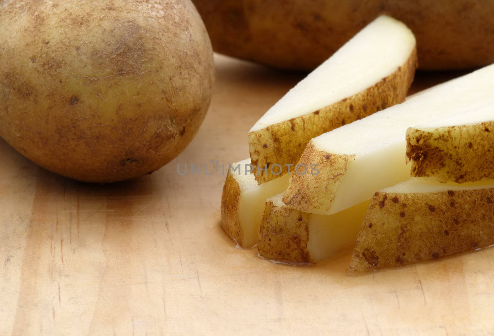 Fresh cut potatoes by carterphoto
