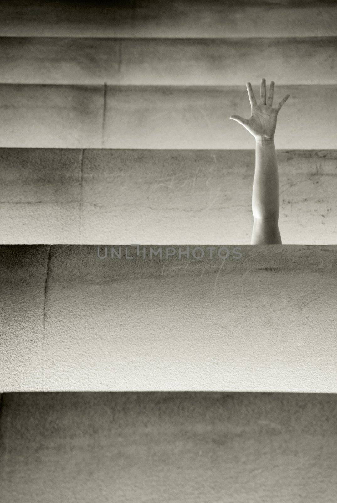 petitionary hand gesture showing drowing in justice pillars, selective focus on hand