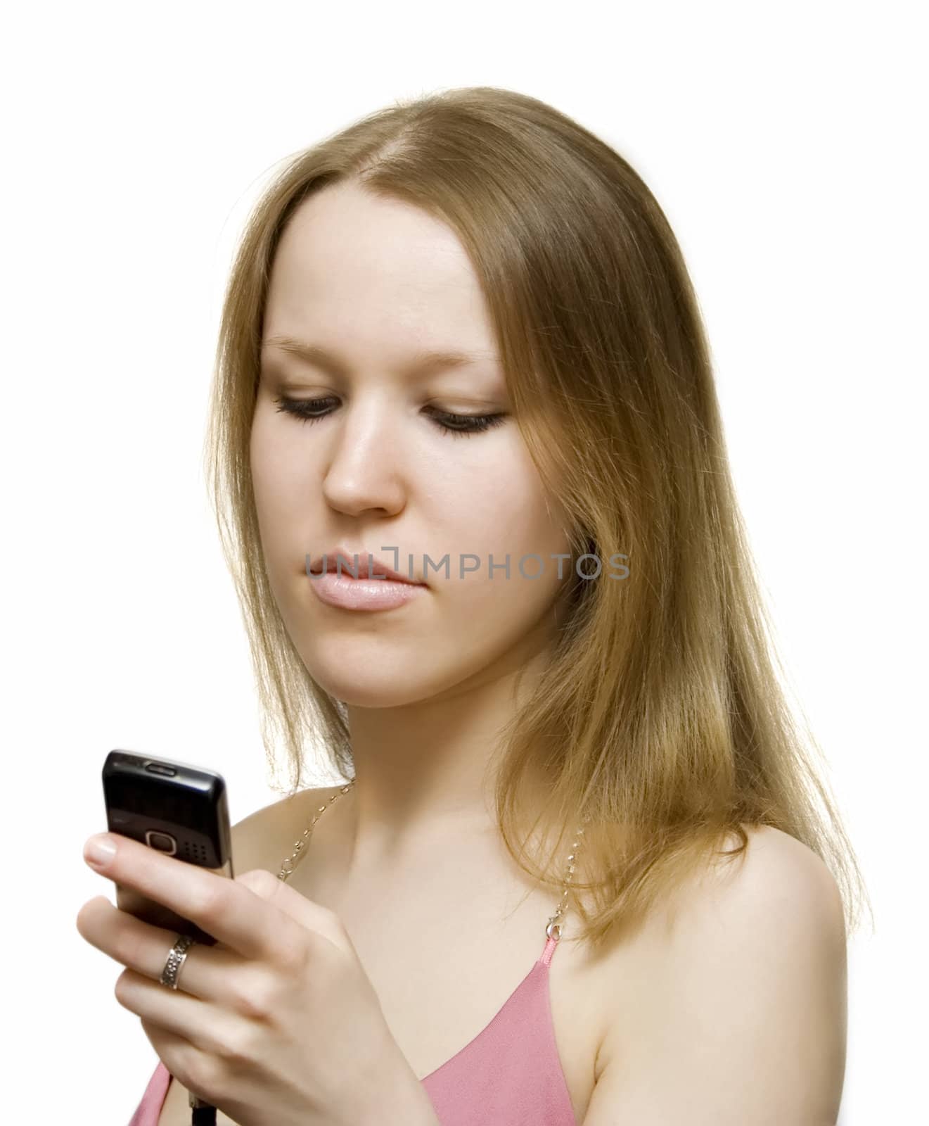Young girl typing SMS