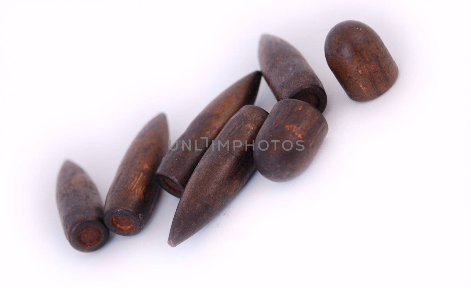 macro set of old used 7,62 mm bullets of AK47 and of 9 mm TT isolated on white