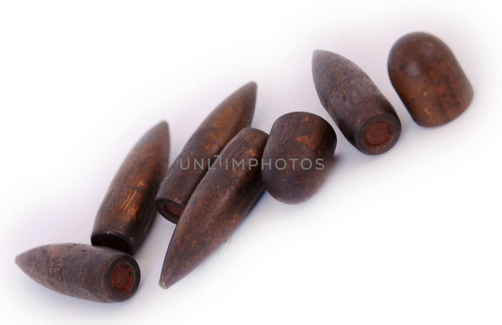 macro set of old used 7,62 mm bullets of AK47 and of 9 mm TT isolated on white