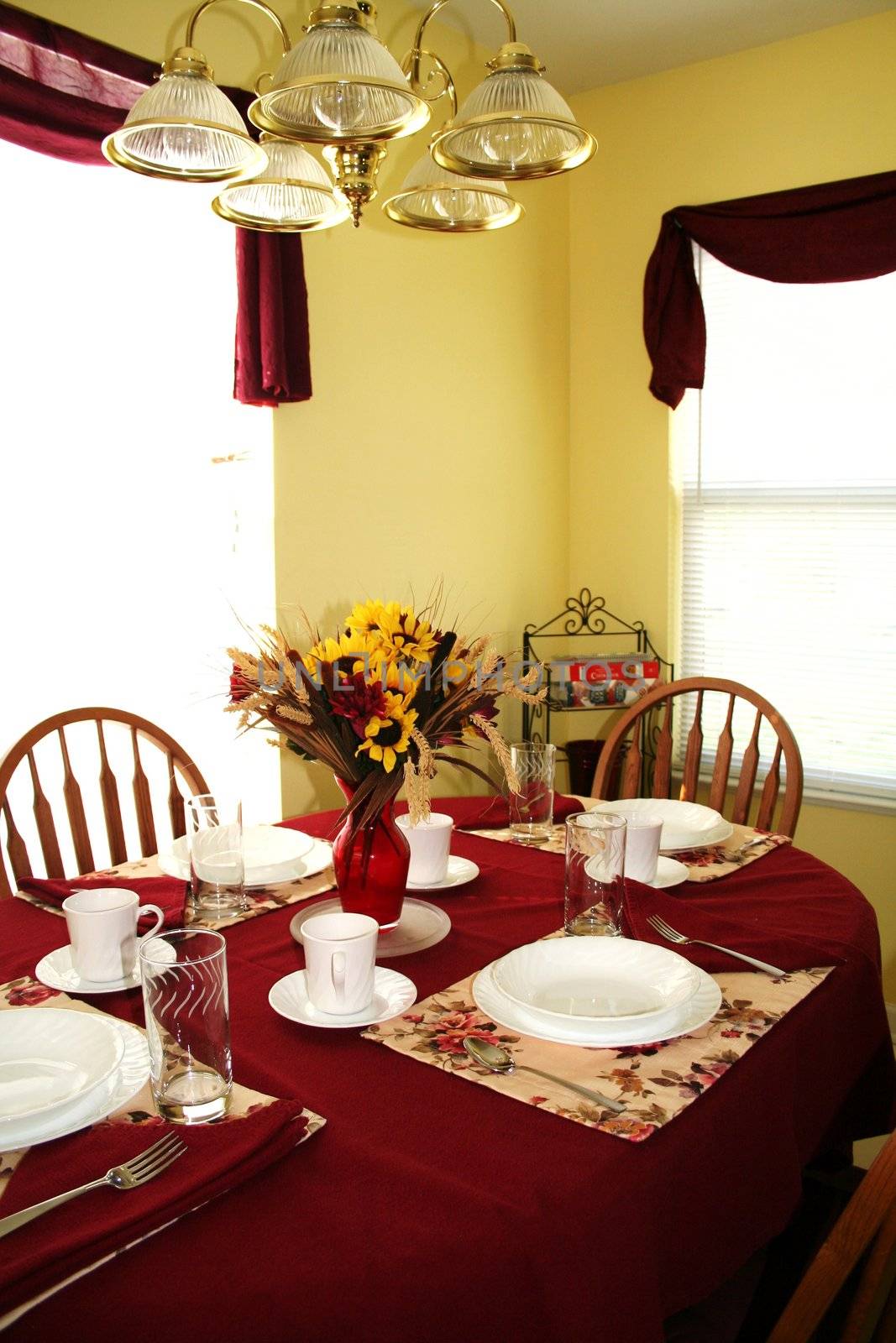 A small kitchen table set for a meal
