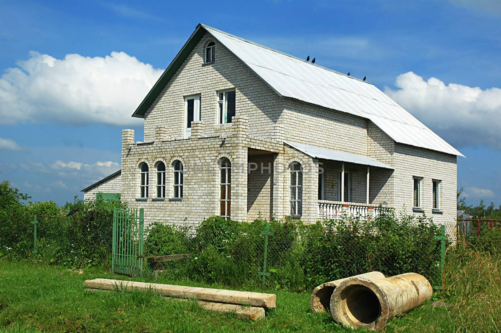 Individual apartment house from a white brick