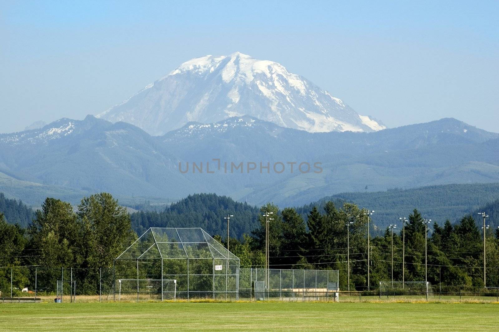 Mount Rainier Towers over Soccer Field by suwanneeredhead