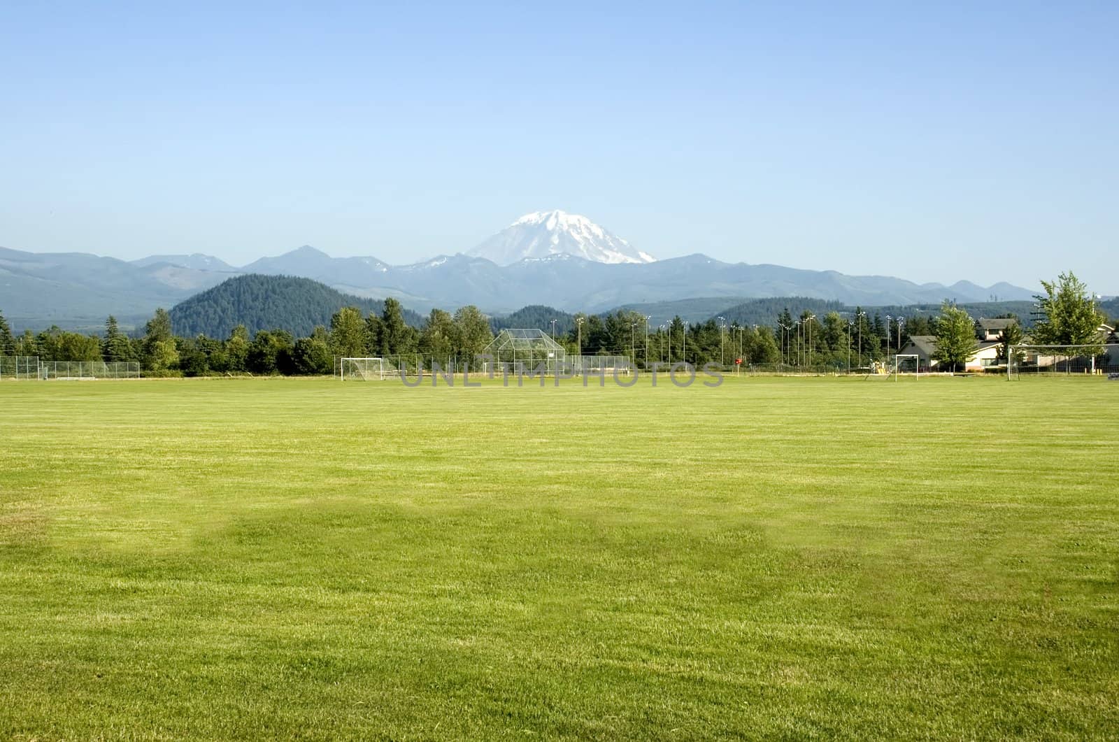Mount Rainier looms large over the sports fields in this rural Washington town.