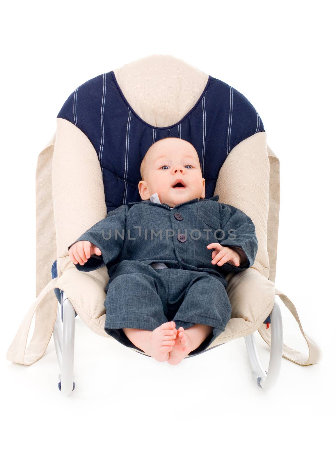 Little infant businessman in a suit sitting