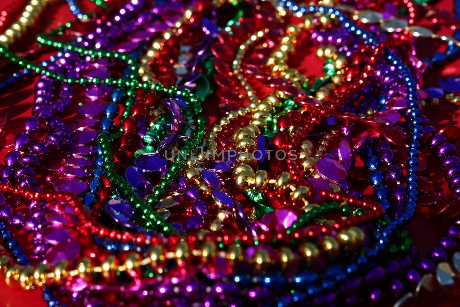 A background image of strings of colorful beads.