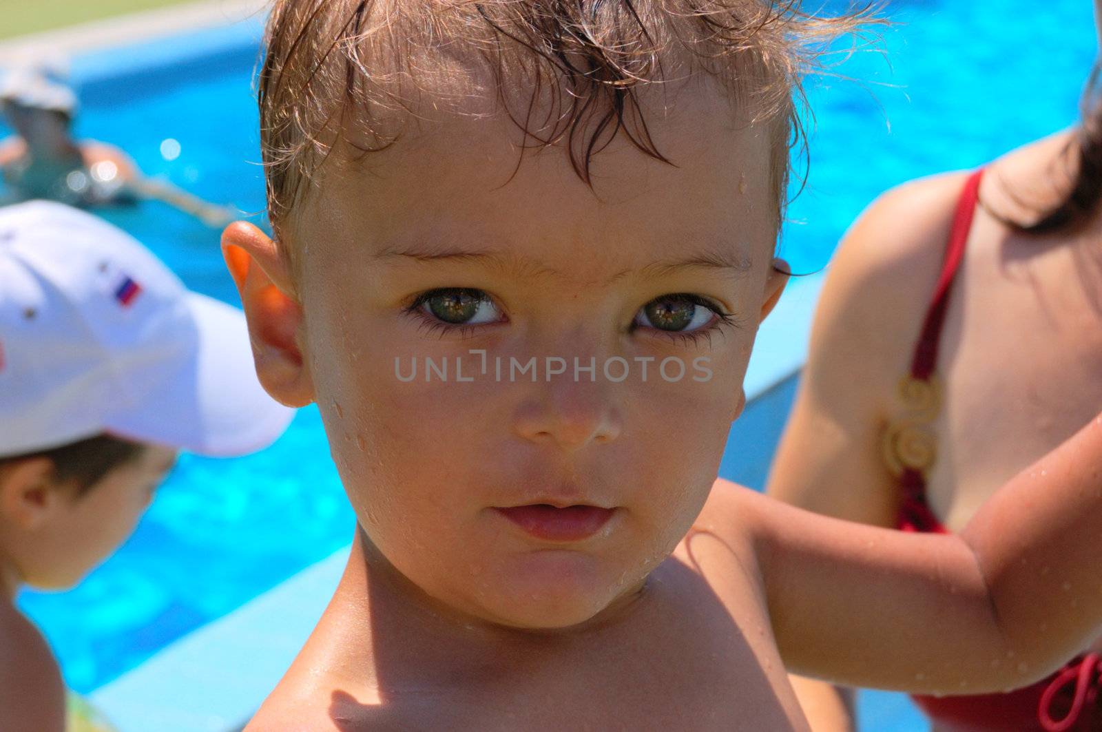 little boy at swimming pool having fun