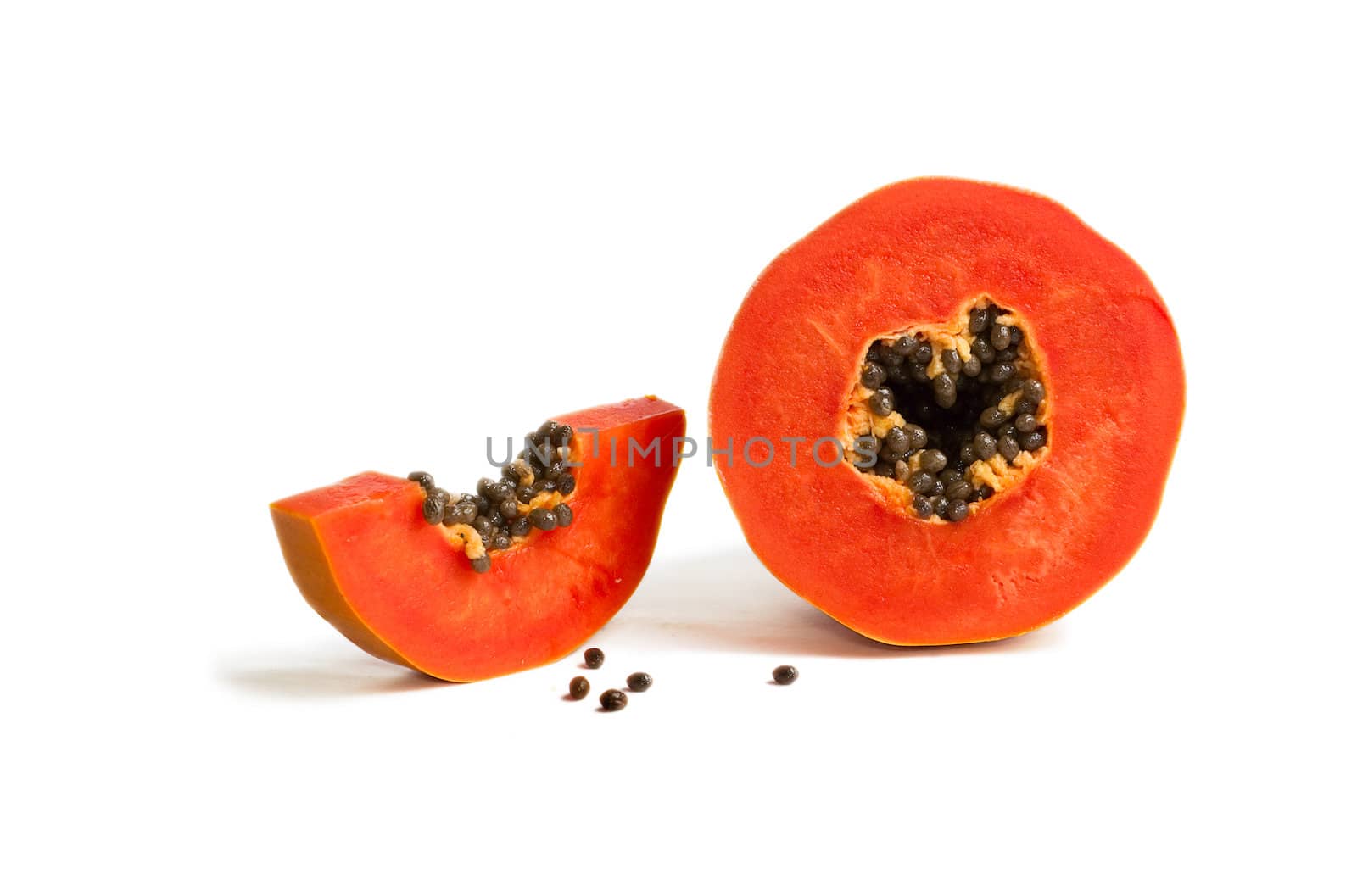 Slice of bright orange sweet mellow papaya isolated on white