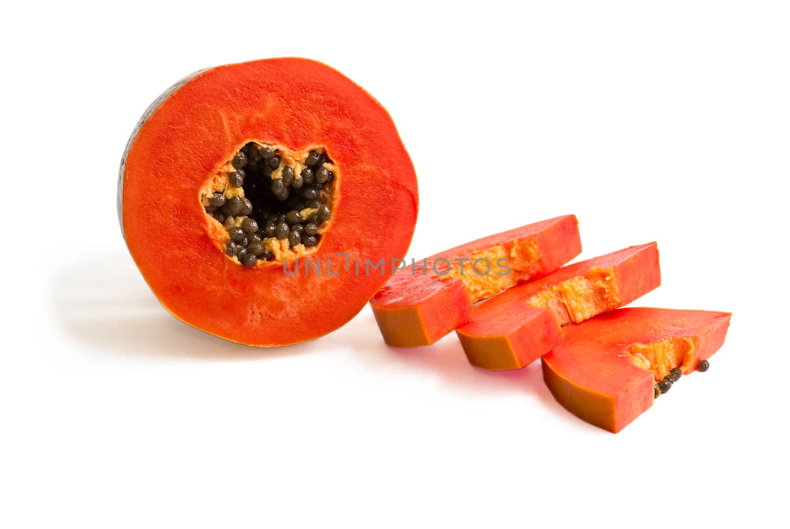 Slice of bright orange sweet mellow papaya isolated on white