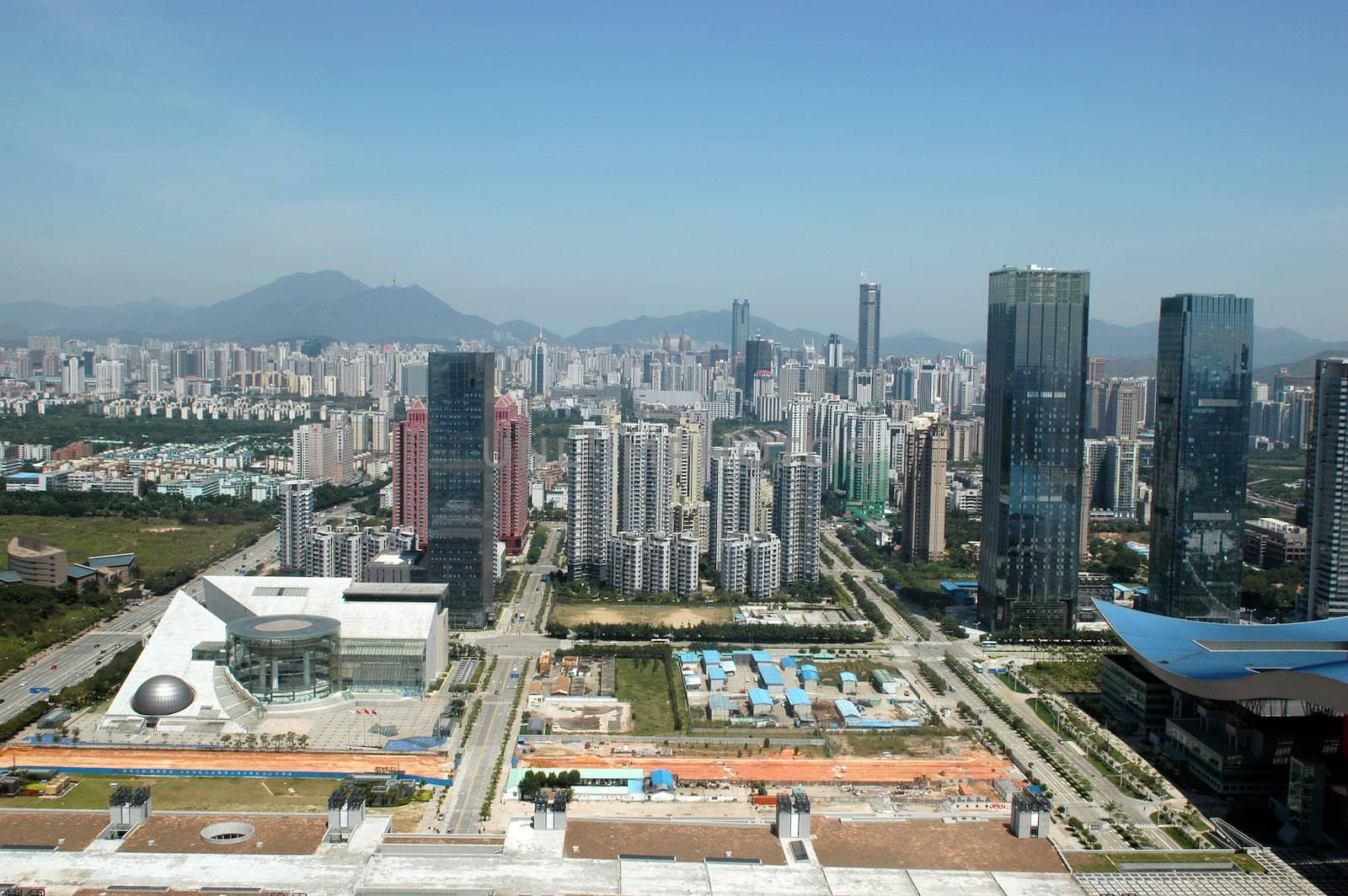 China, Guangdong province, modern, prosperous Shenzhen city. General, aerial view from high building. New office skyscrapers, shops and hotels in Futian district.