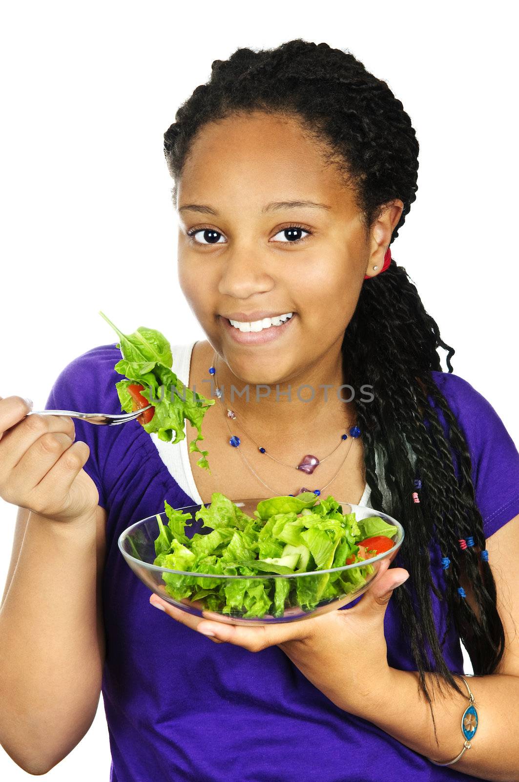 Isolated portrait of black teenage girl with salad bowl