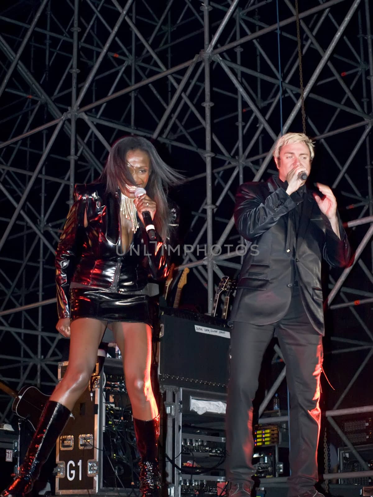 Duran Duran frontman and vocalist Simon Le Bon and backing vocalist Anna Ross live on stage in Malta on 26th July 2008 during Red Carpet Massacre Tour