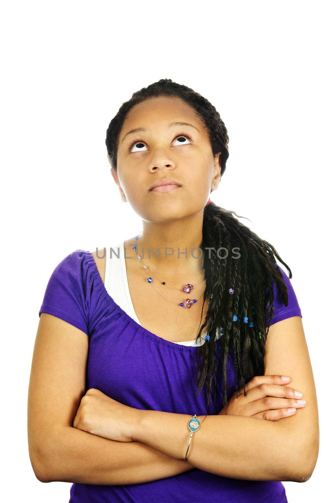 Isolated portrait of  black teenage girl with arms crossed