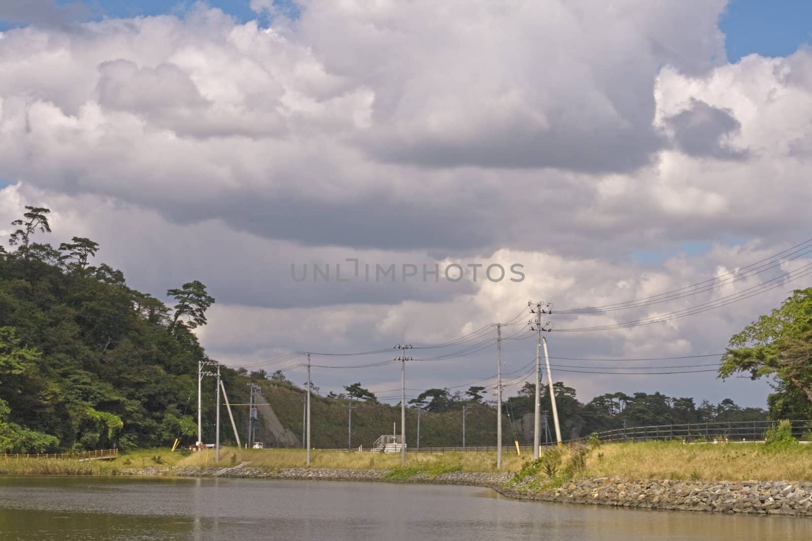 Sumer landscape with impressive clouds few minutes just before the storm.Location:Matsushima,Japan.This is a useful image for a forecast website, for example.Shot with Canon 70-200mm f/2.8L IS USM
