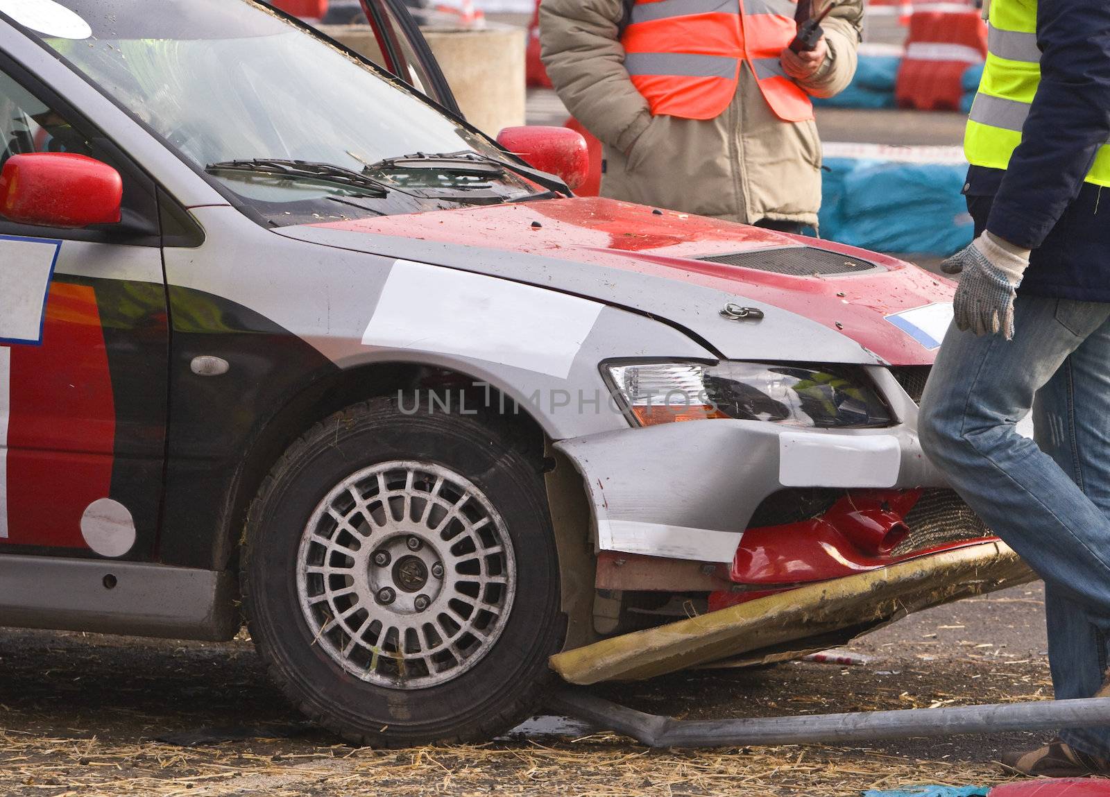Detail of an car accident during a car race.