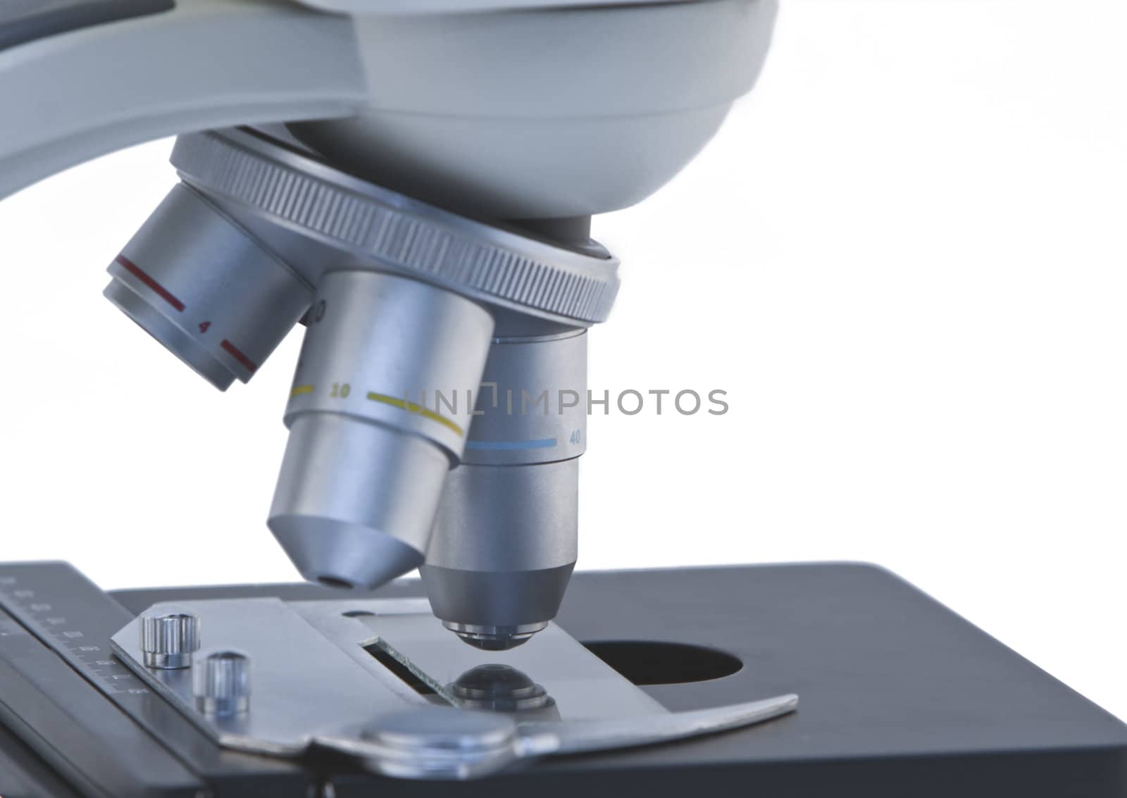 Close-up image of microscope lenses isolated against a white background.Shot with Canon 70-200mm f/2.8L IS USM