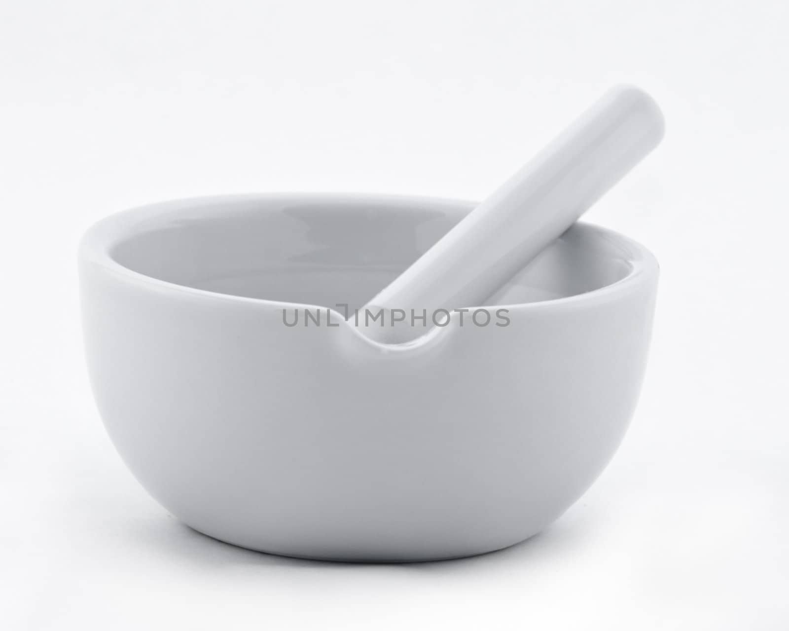 Image of a ceramic grinding mortar isolated against a white background.