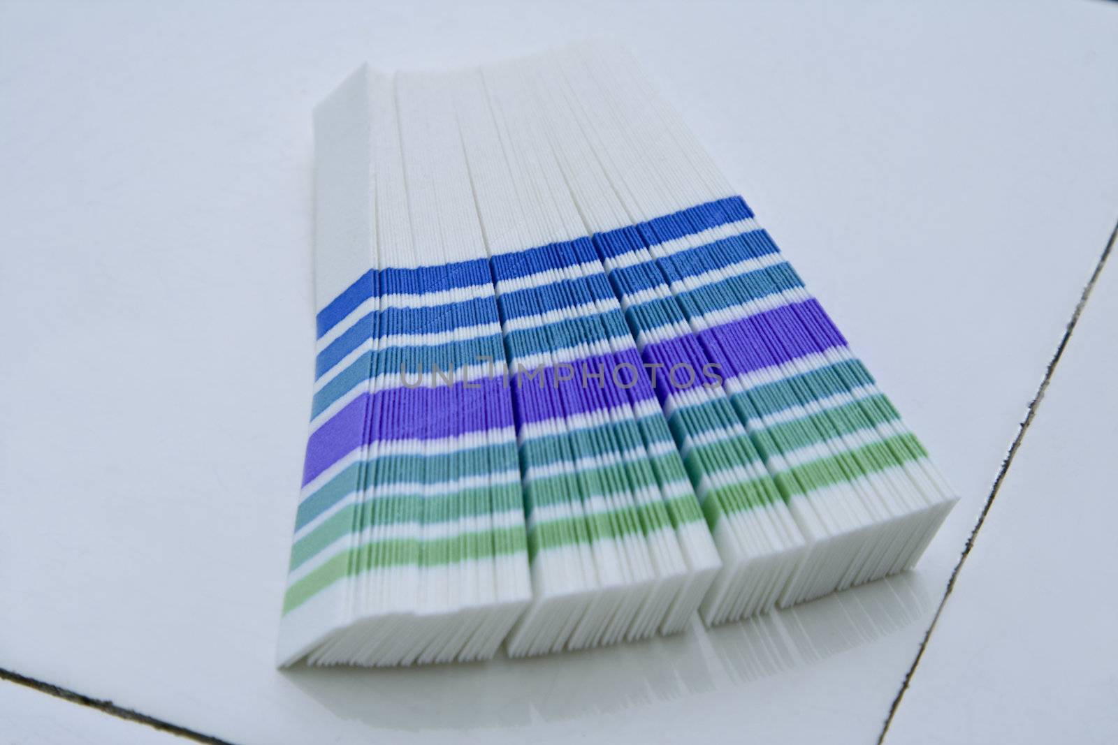 Indicator strips on a faience lab desk.