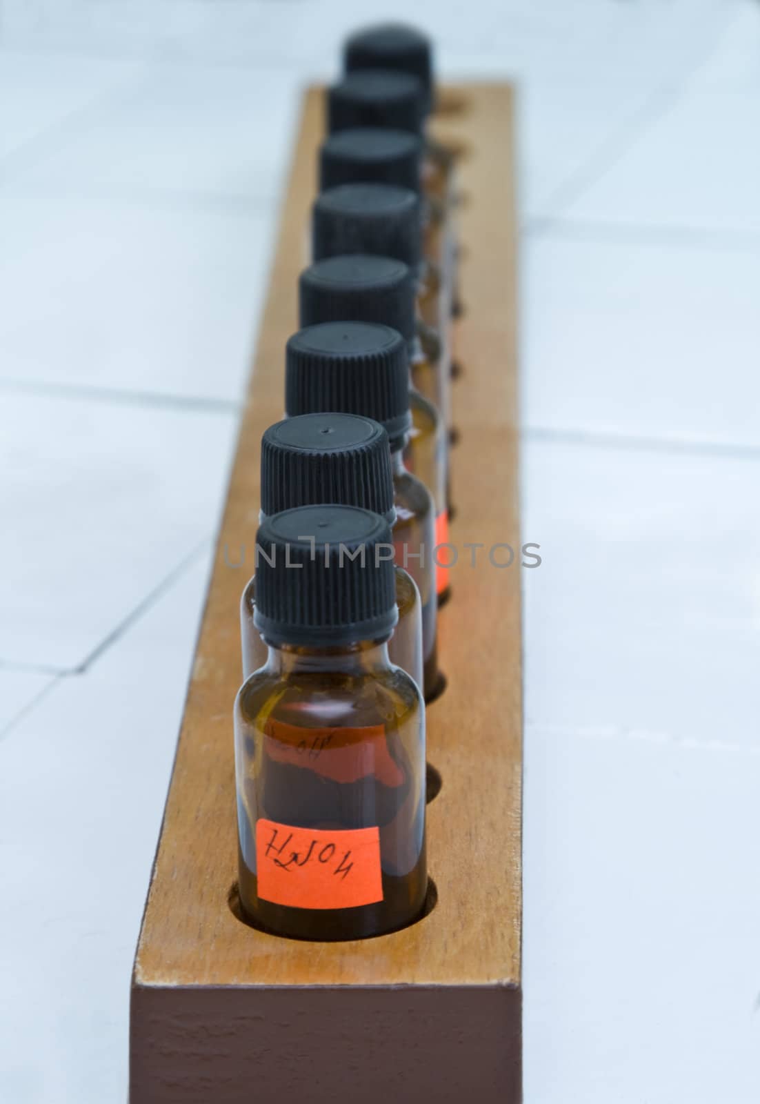 Image of a row of brown laboratory bottles.