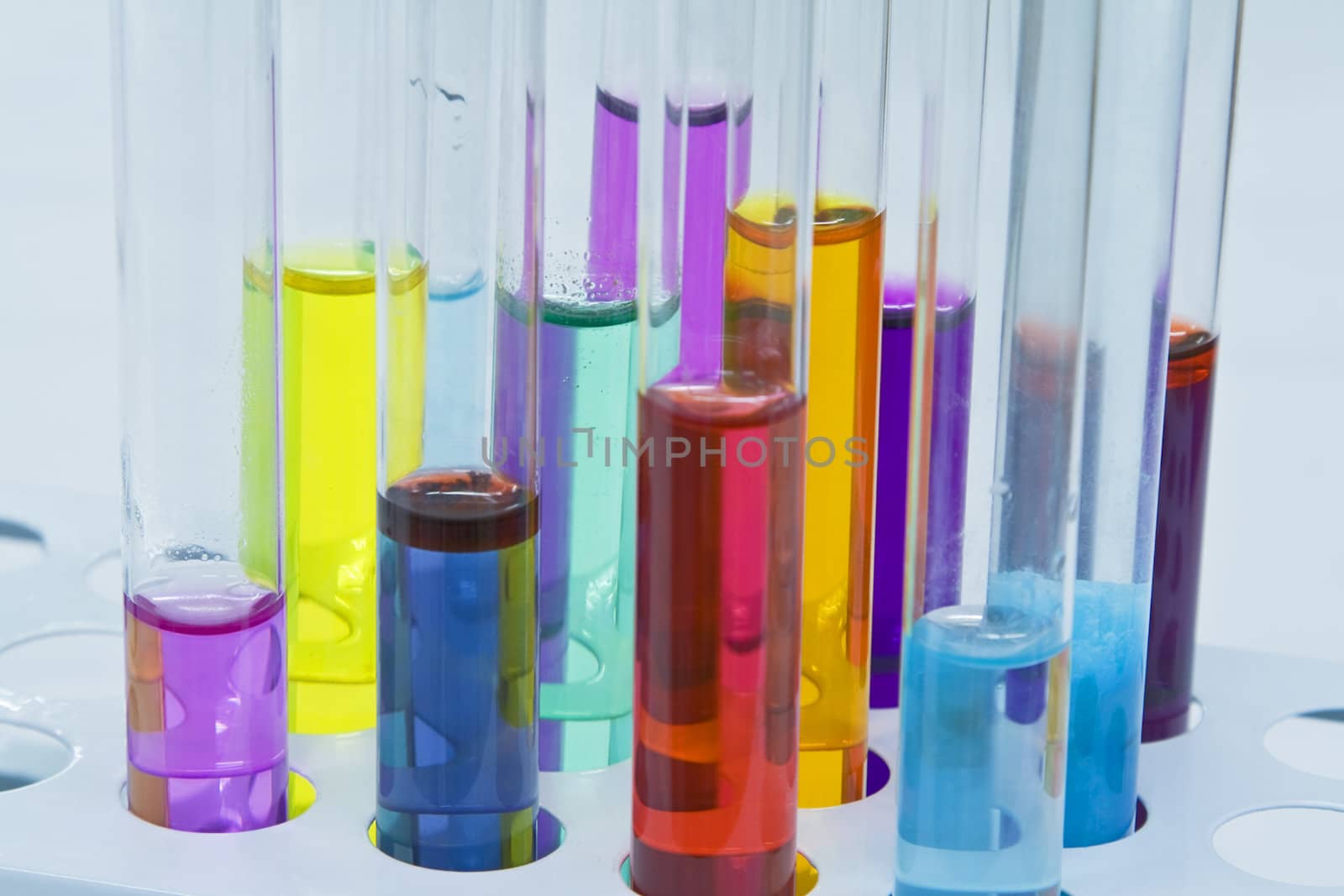 Colorful image of a test tubes stand; unmodified specific lighting for a laboratory.