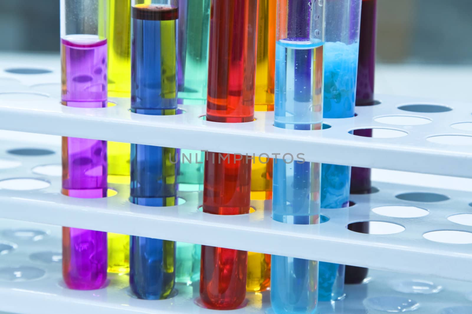 Colorful image of a test tubes stand; unmodified specific lighting for a laboratory.