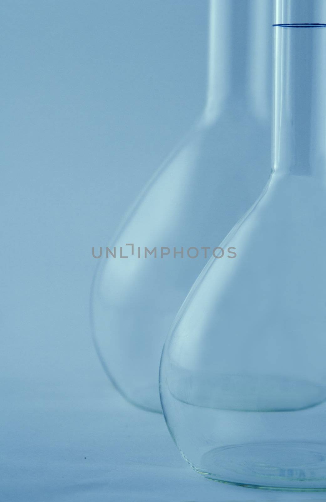 Laboratory flask in a blue environment.