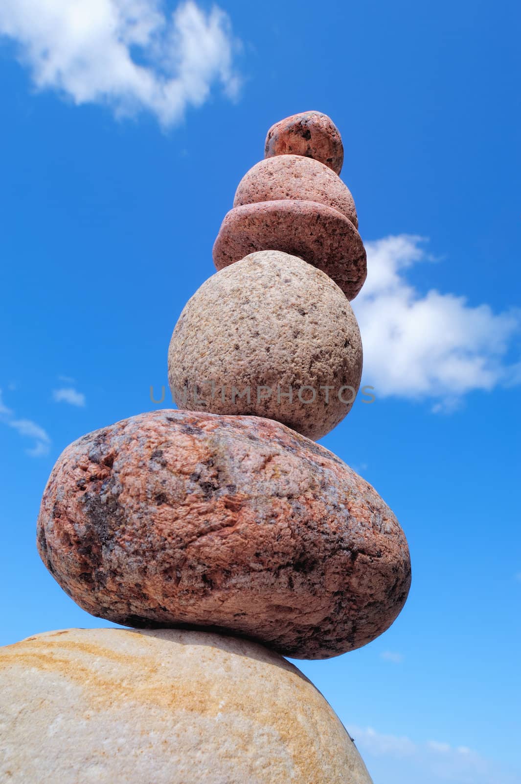 Bottom view of a pile of pebbles against the sky