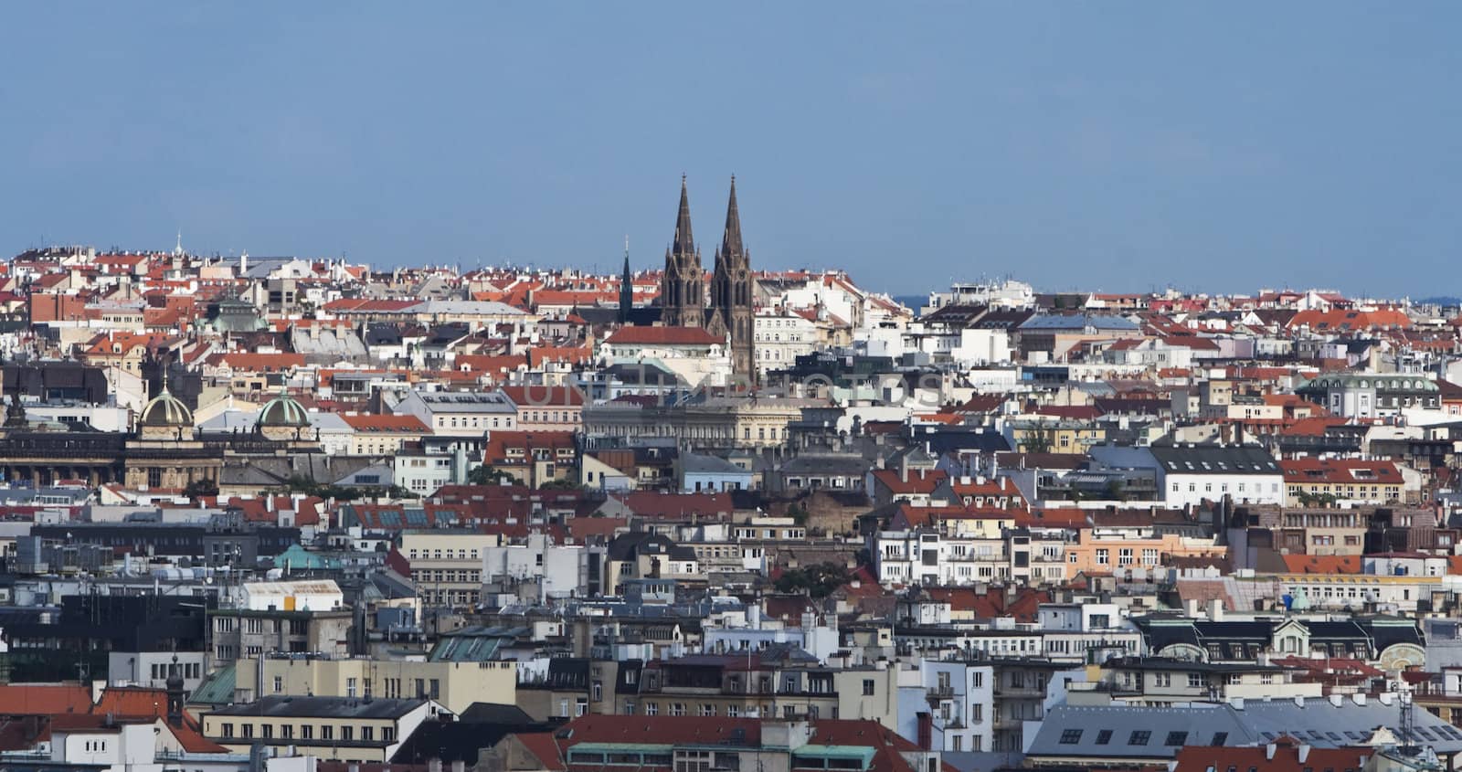 Overview of Prague featuring the Ludmila Church towers.