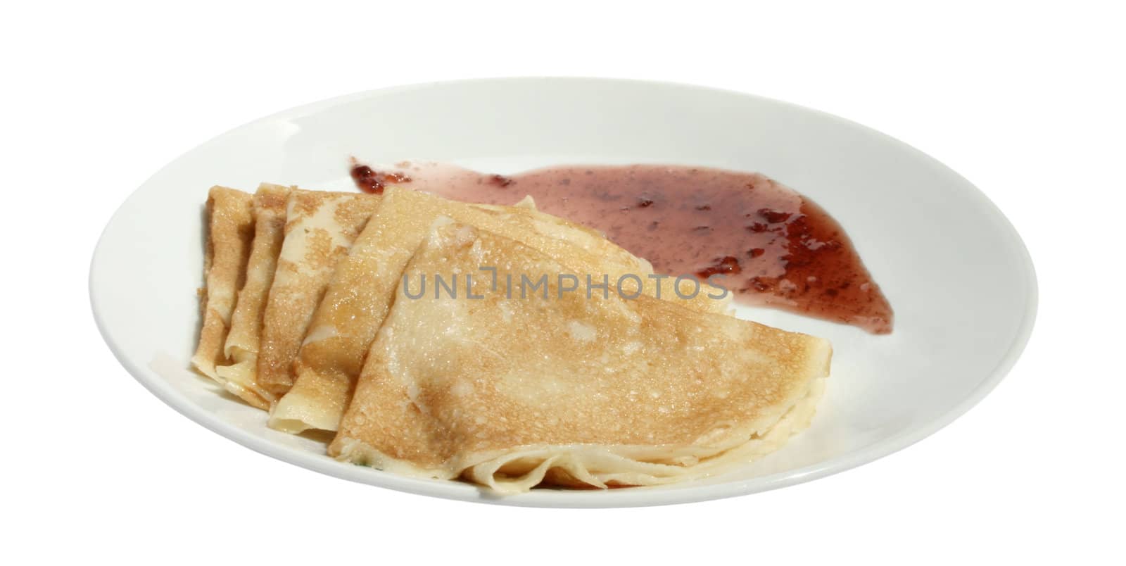 Pancakes with jam on a plate.