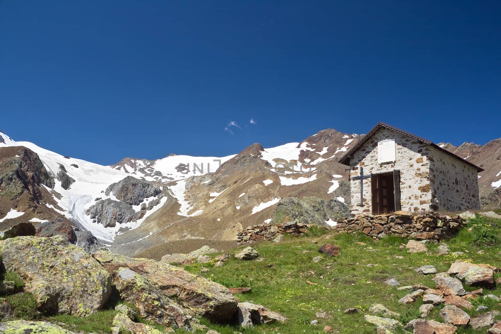 small chapel in Stelvio National park, Trentino, Italy. On the background Cevedale mountain