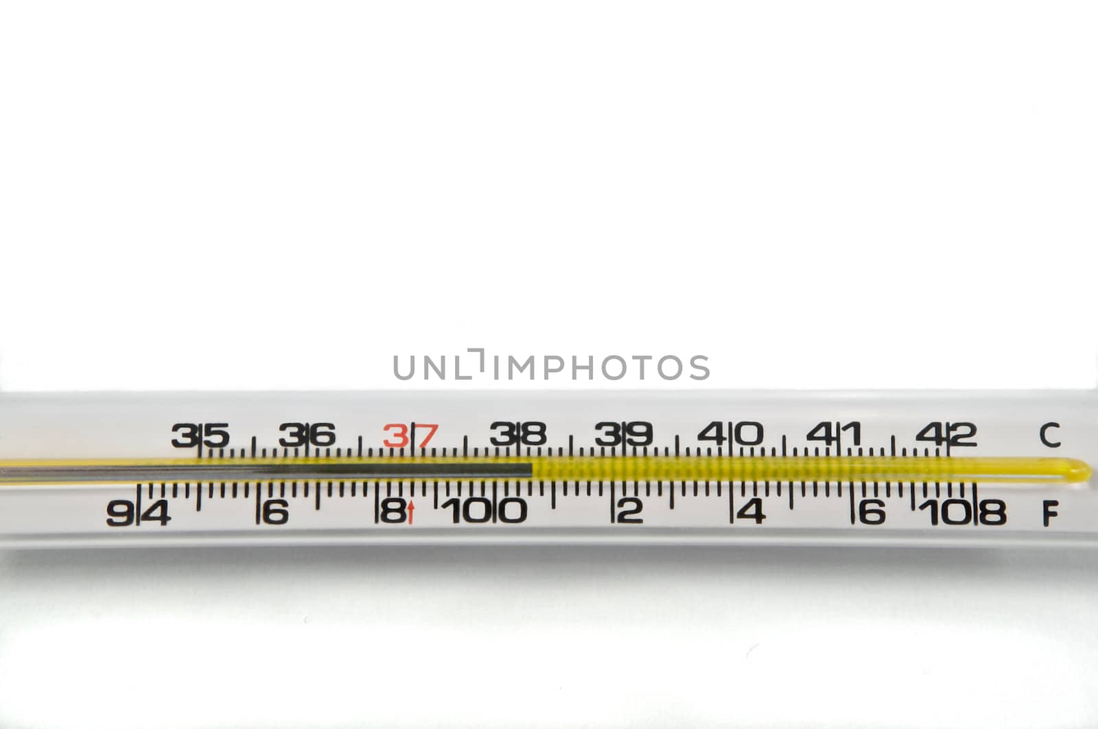 Close up of a mercury thermometer showing a high human temperature reading. Arranged horizontally on white.