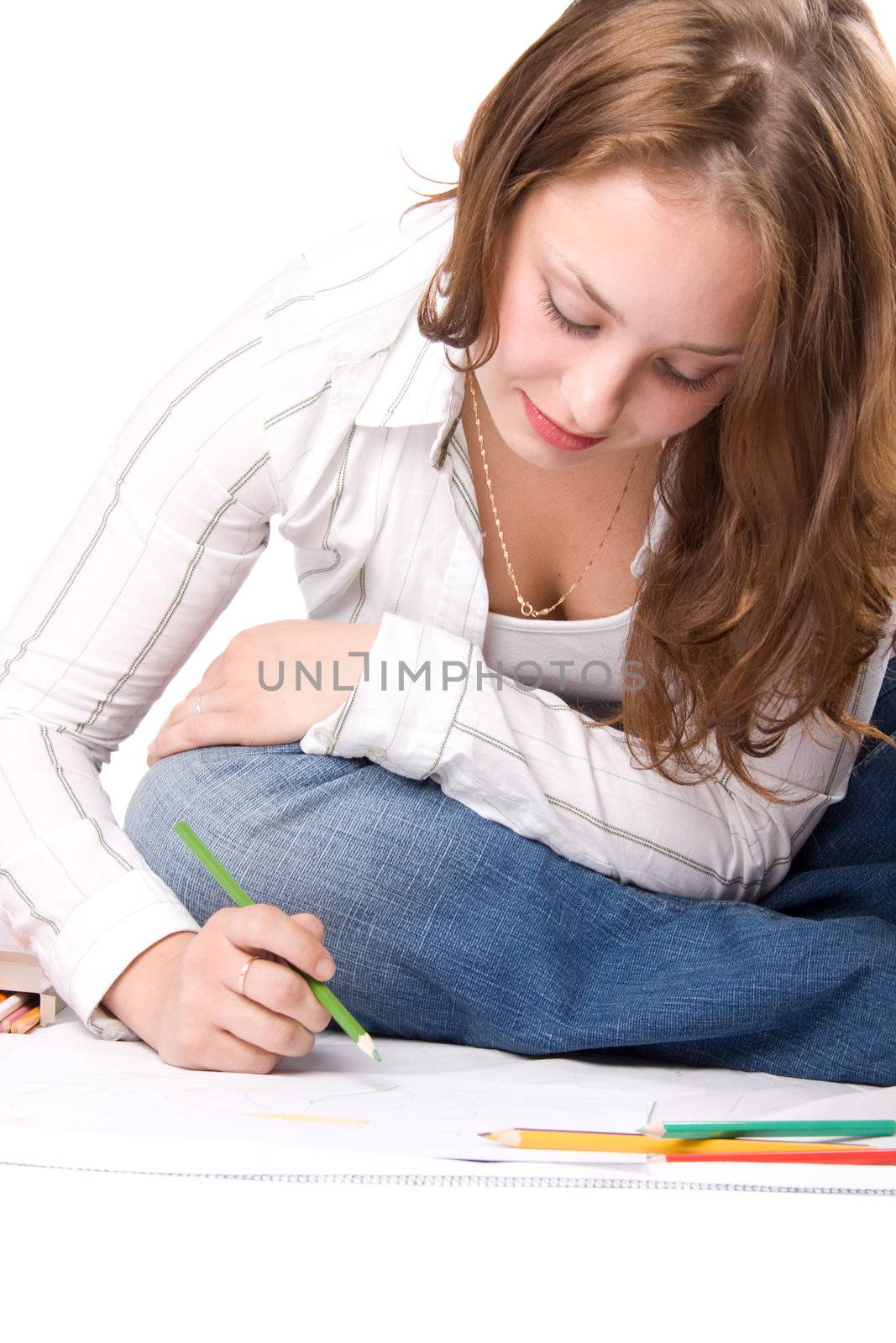 Beautiful girl is drawing with crayons. Isolated on white. #5
