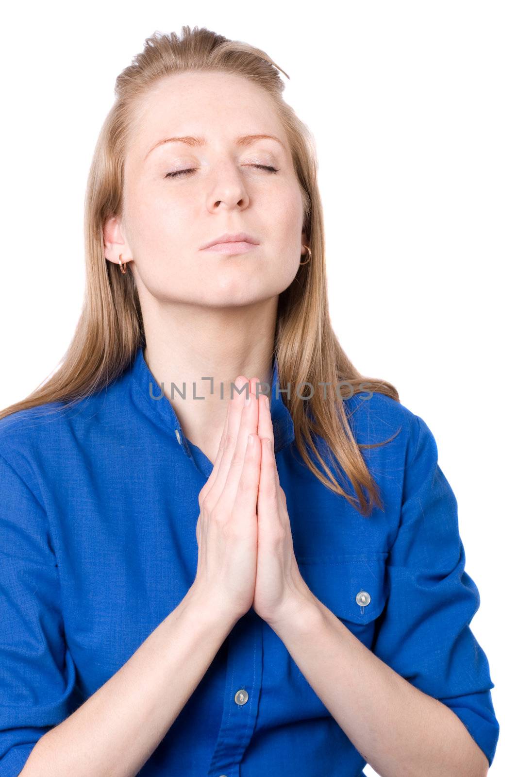 Young woman praying. Isolated on white.