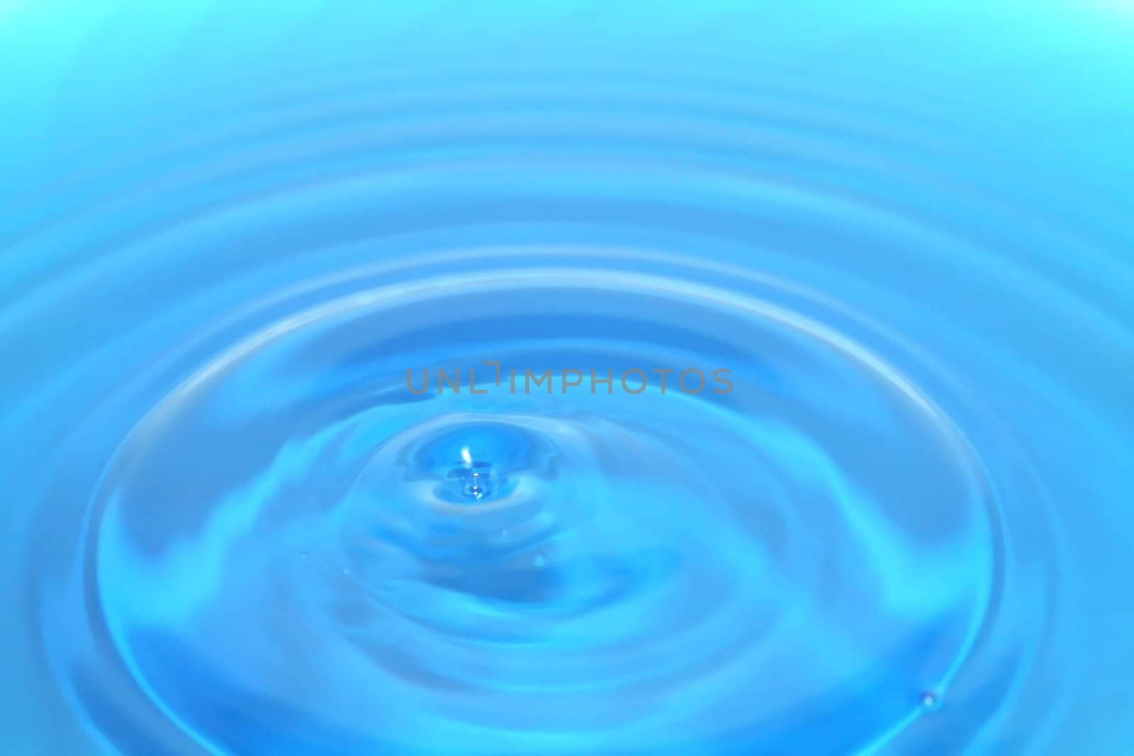 Blue water ripples emanating from one source.