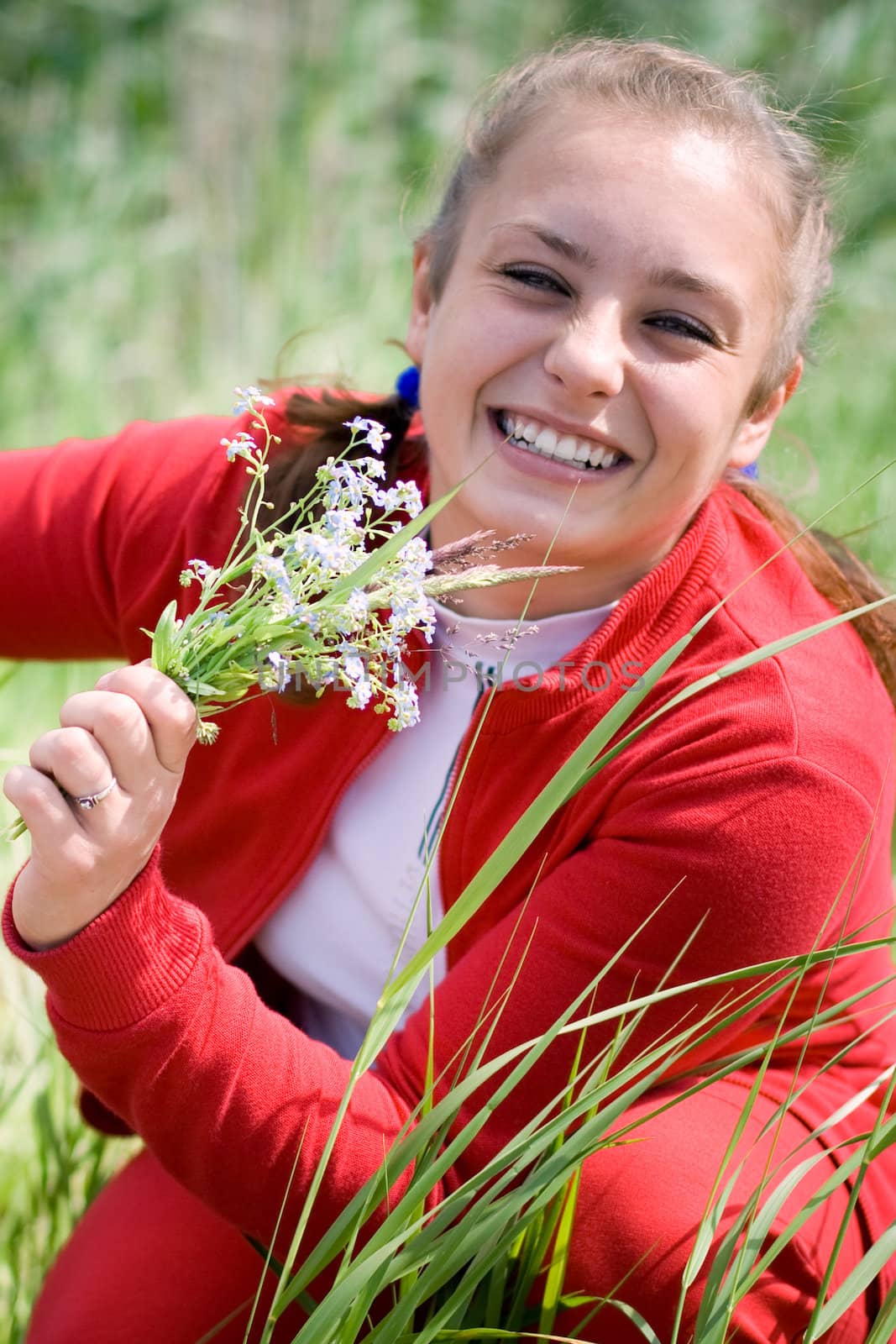 Beautiful smiling girl gathering flowers. #1