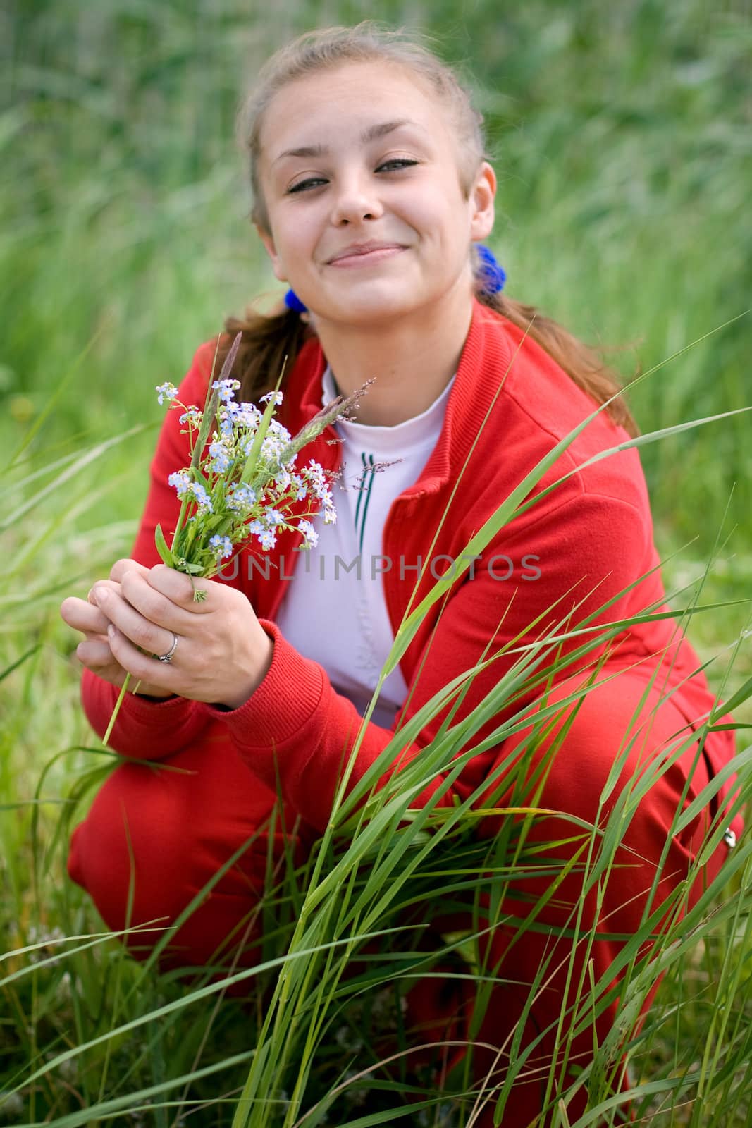 Beautiful smiling girl gathering flowers. #2