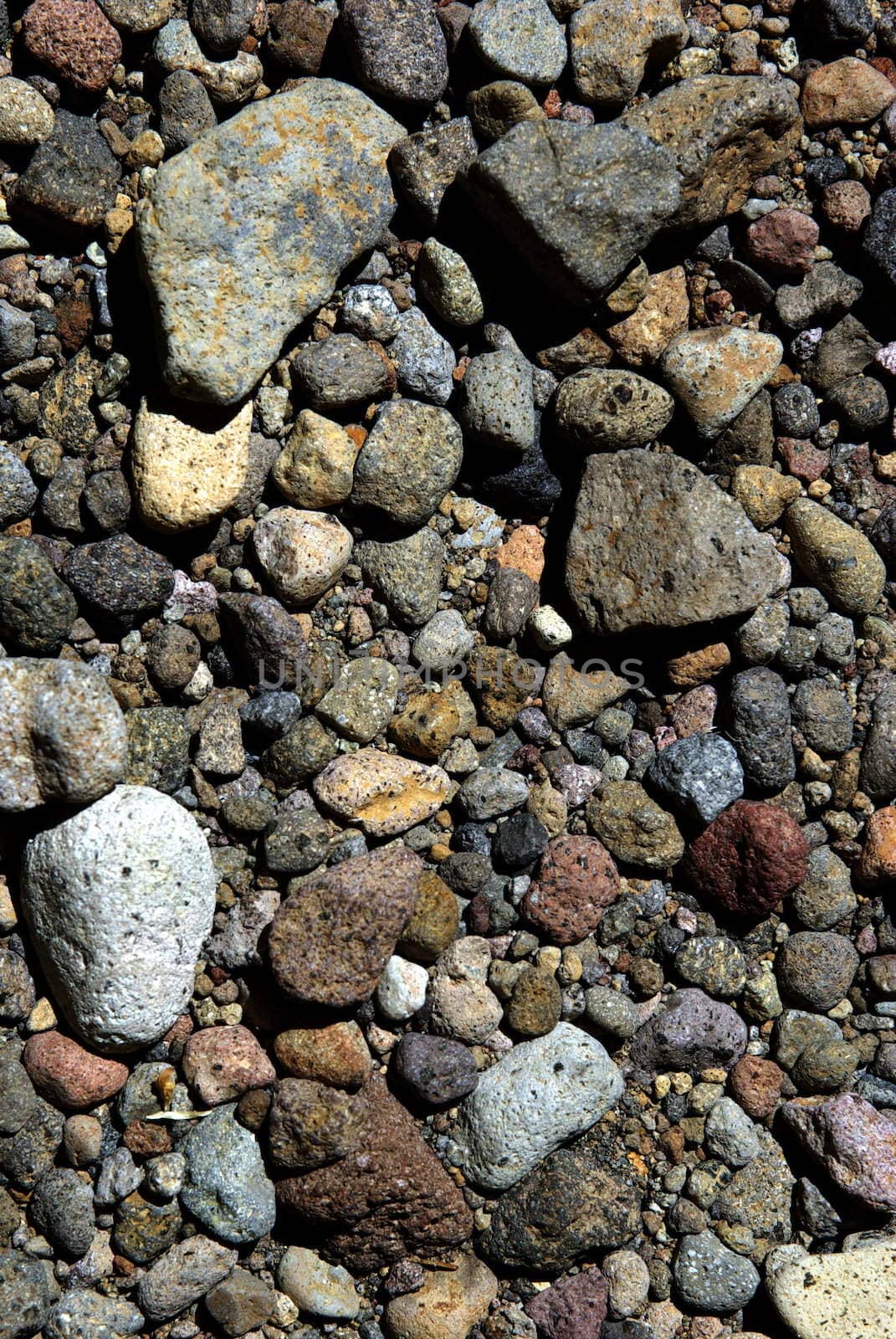 Multi colored volcanic rock background also know as igneous rock.