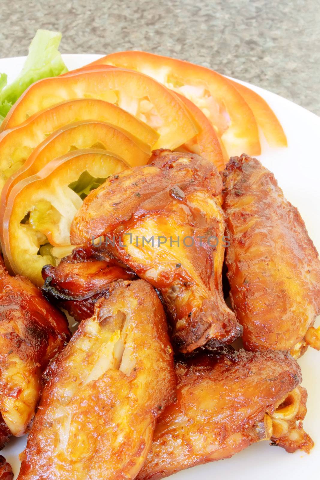 Spicy Buffalo Wings Barbecued on a Plate