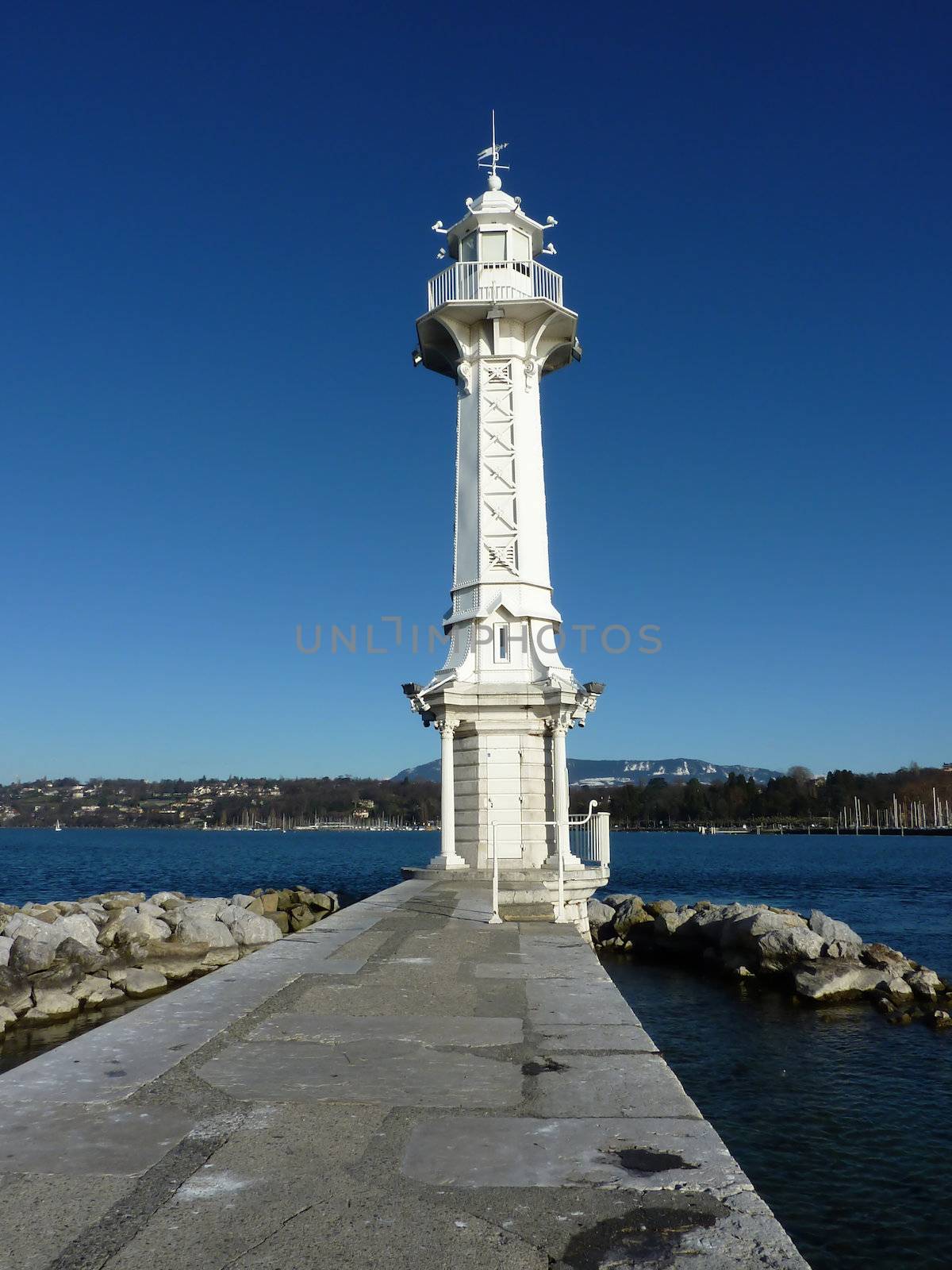 White lighthouse on Geneva lake, Switzerland, by beautiful weather