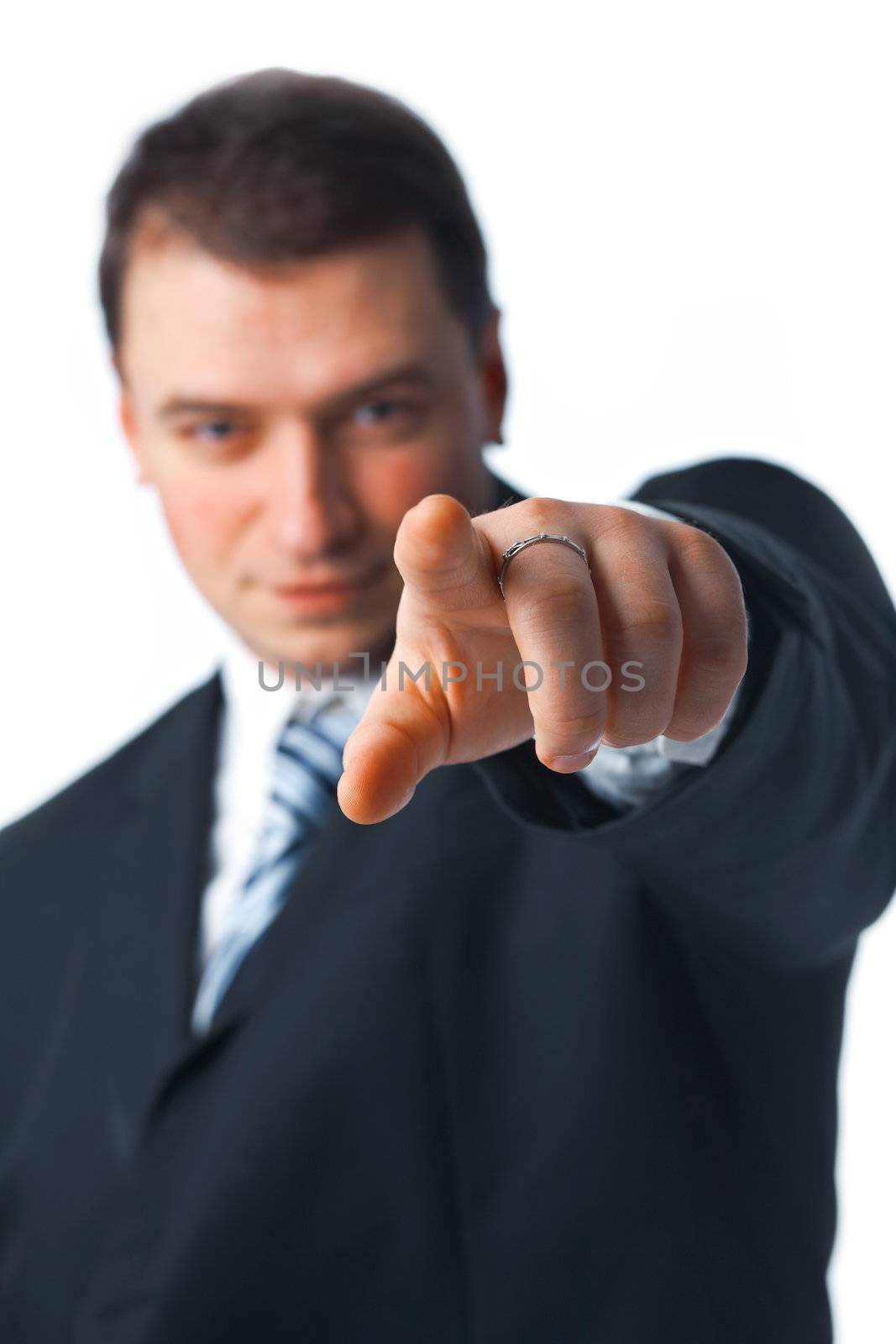 Close up portrait of young confident business man pointing to you isolated on white background