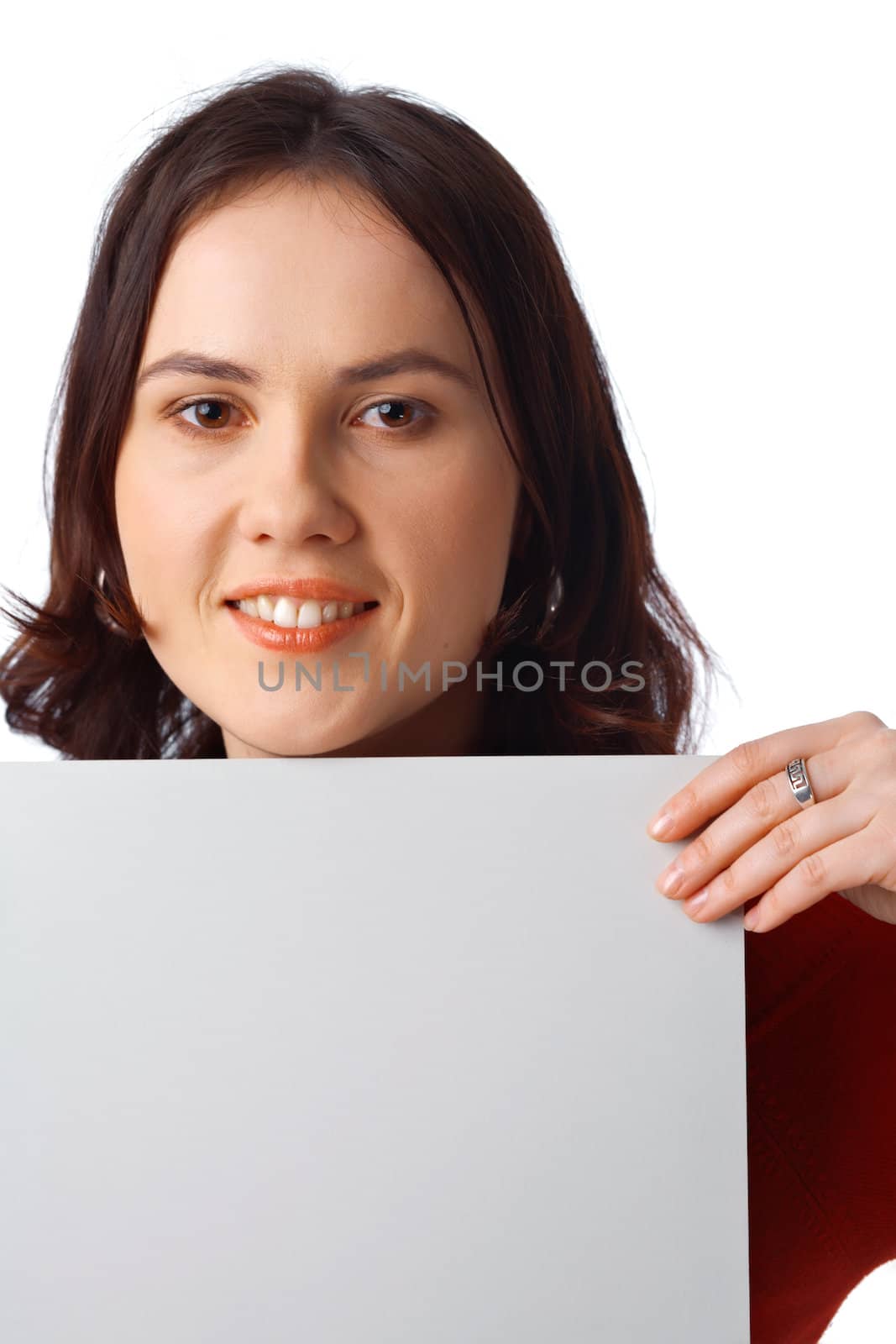 Closeup portrait of a pretty young woman holding a blank billboard on white