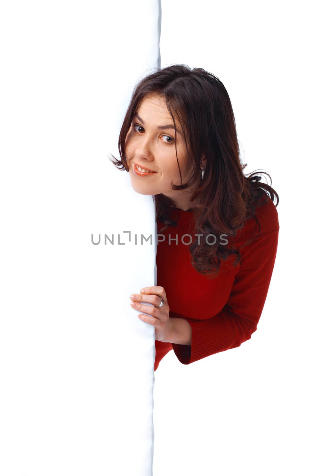  Portrait of a happy young girl peeping over an empty billboard on white background 