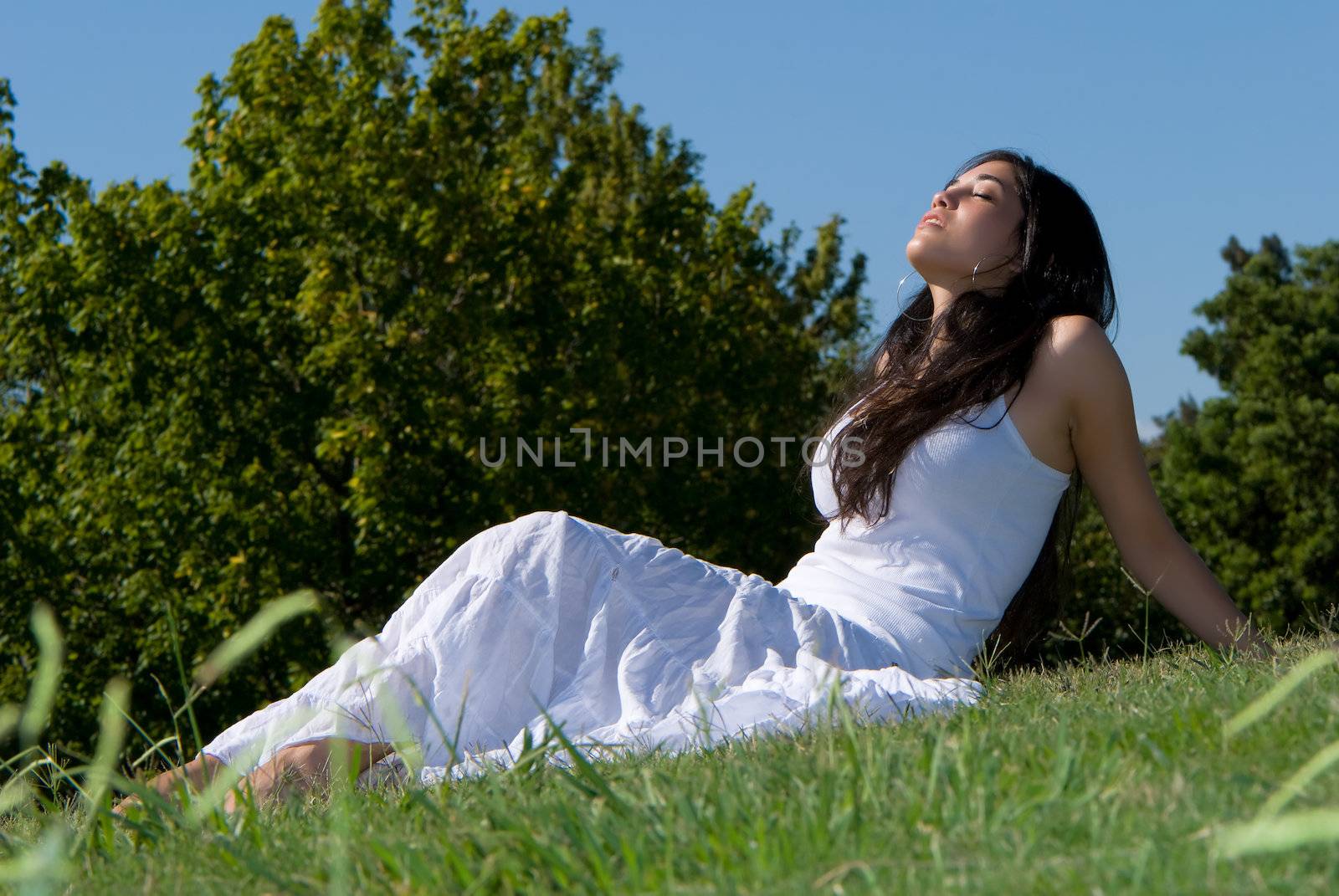 Relaxing girl on meadow