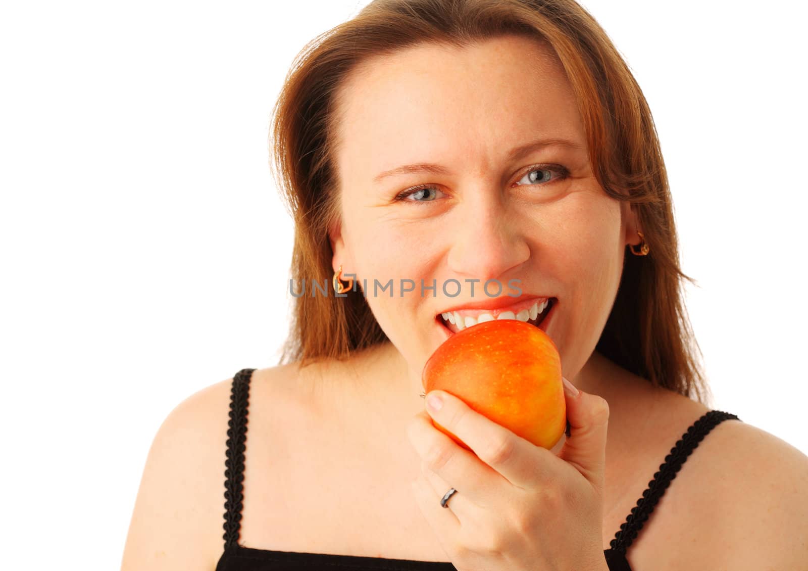 Closeup portrait of a young pretty woman eating a red apple, isolated over white background 