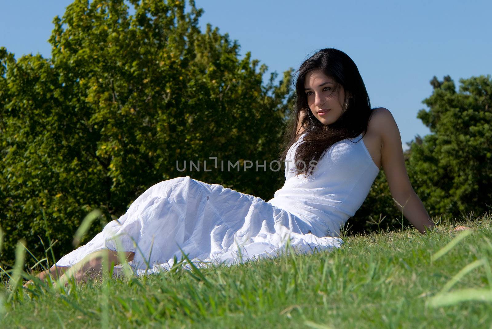 Relaxing girl on meadow