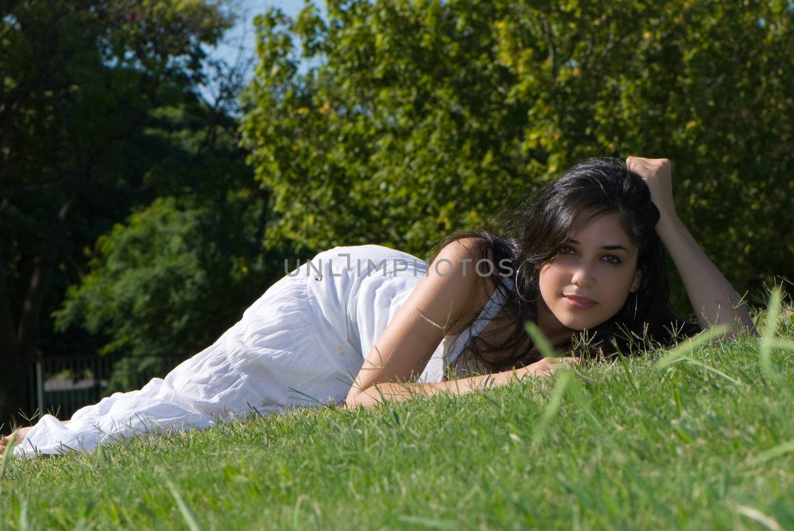 Relaxing girl on meadow