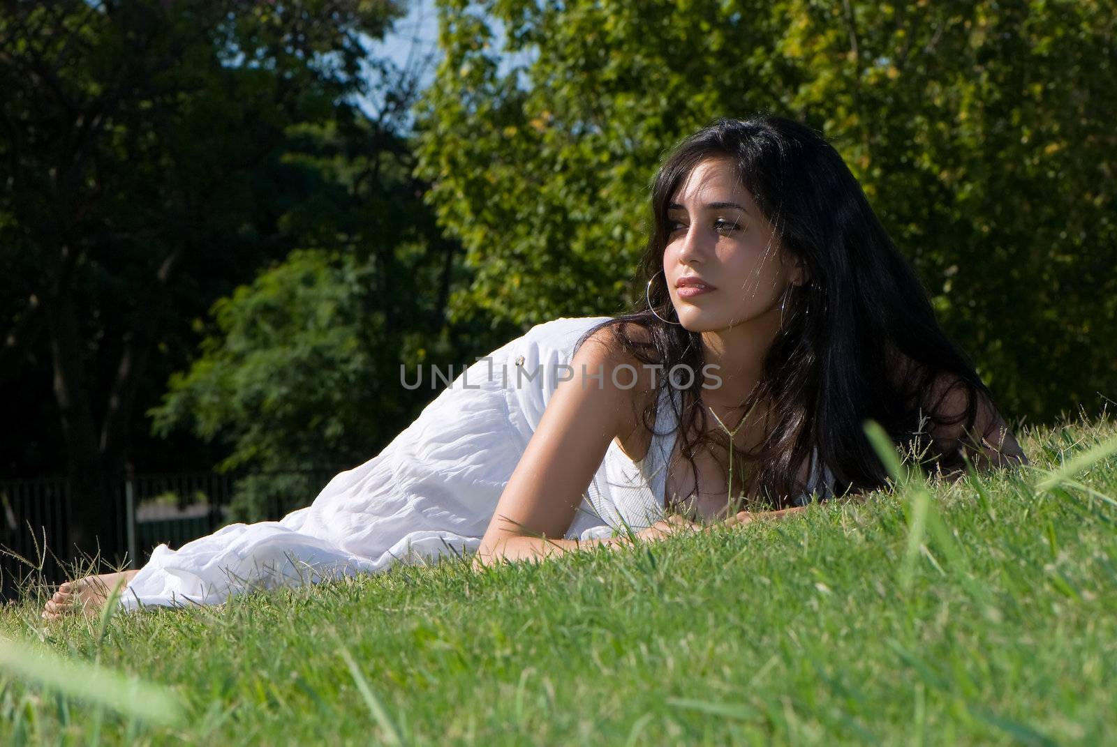 Relaxing girl on meadow