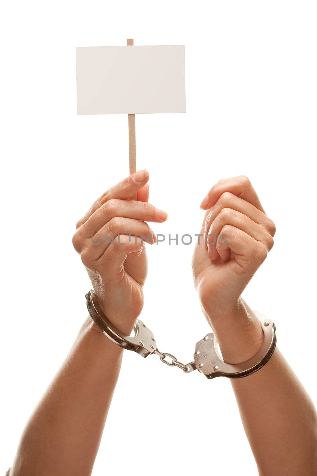 Handcuffed Woman Holding Blank White Sign Isolated on a White Background - Ready for Your Own Message.