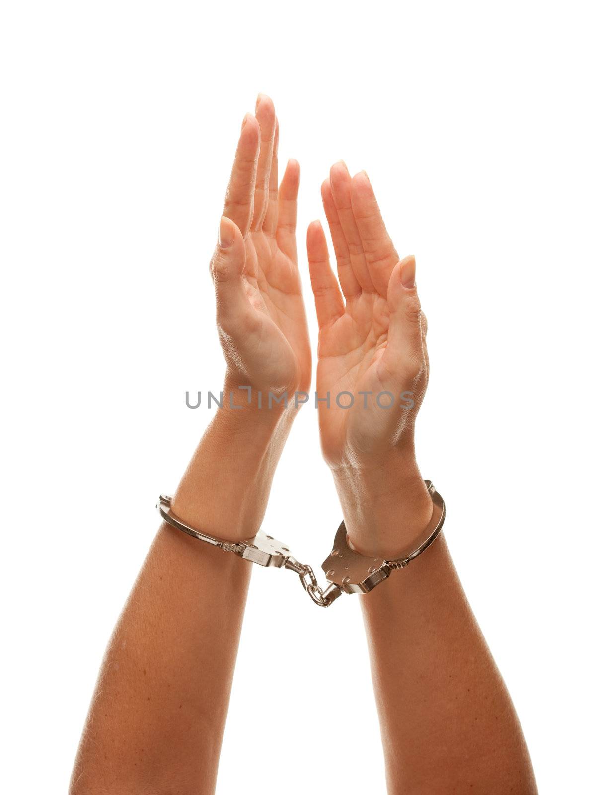 Handcuffed Woman Desperately Raising Hands in Air Isolated on a White Background.